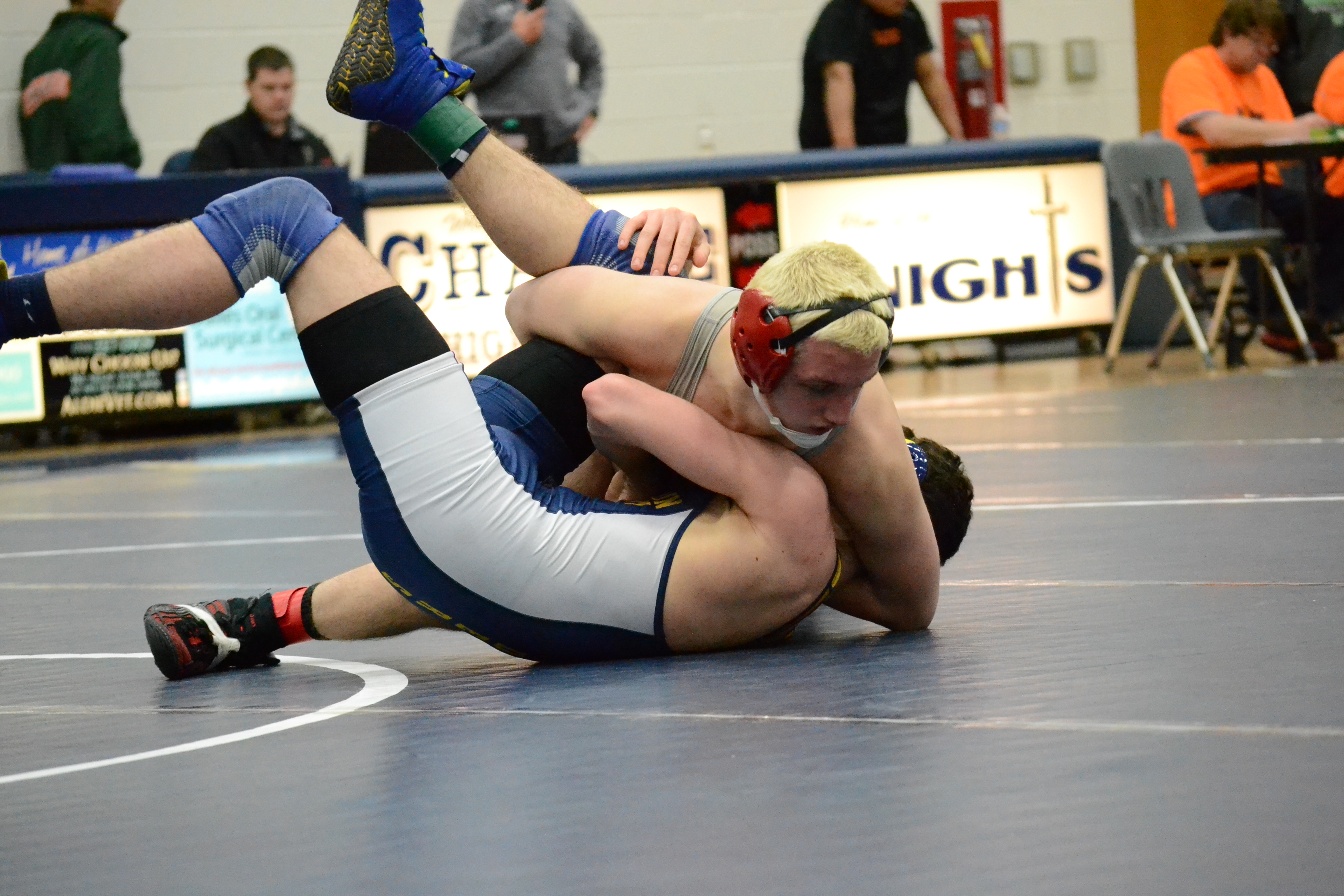Sophomore Matt Raines pins a Loudoun County wrestler. Raines placed first in the 132-pound weight class and had a 4-0 record throughout the tournament.