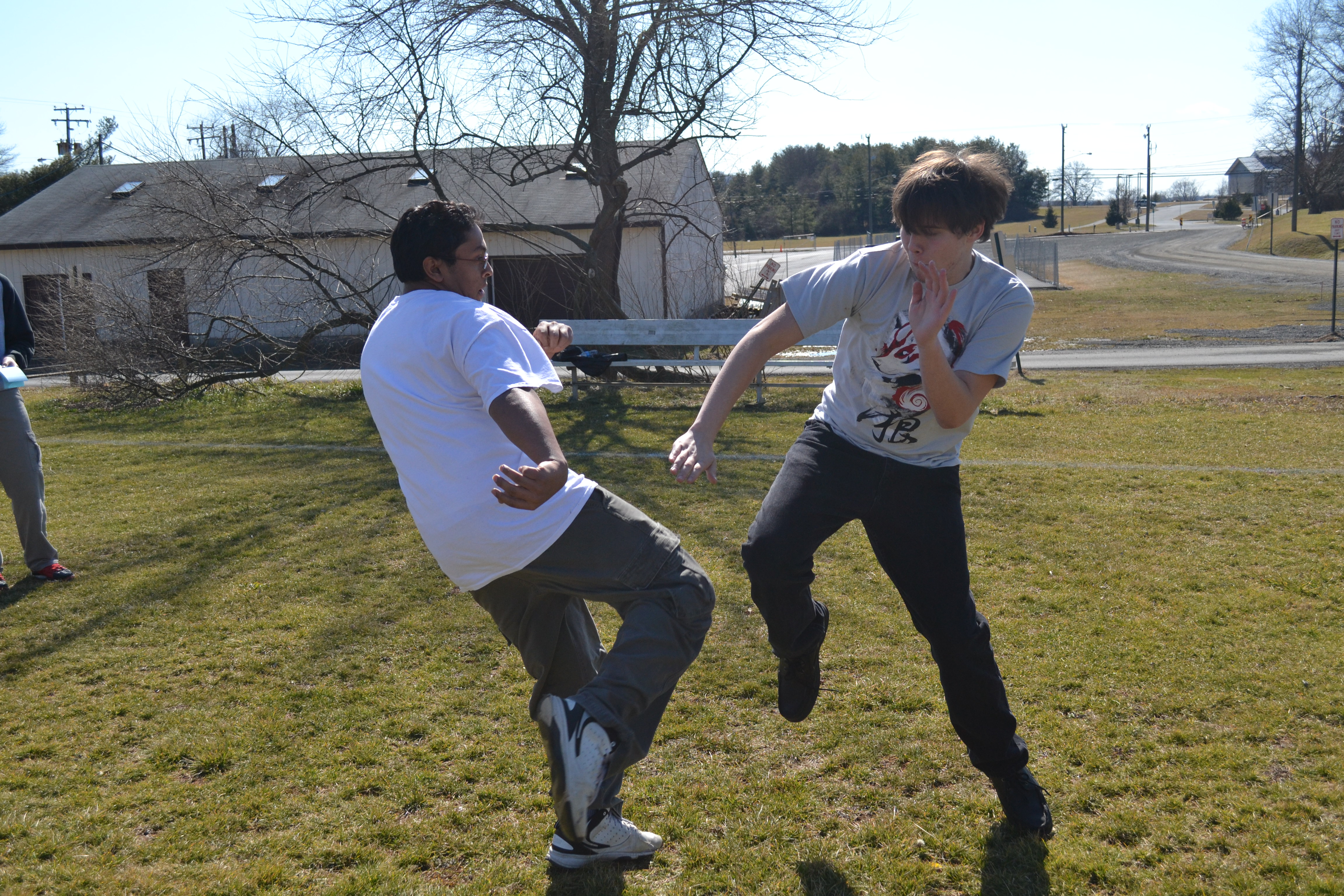 Junior Ian Soule and senior Sergio Ribeiro demonstrate their martial arts outside. “It helps you stay fit and react quickly,” Ribeiro said. “It really promotes self discipline.”