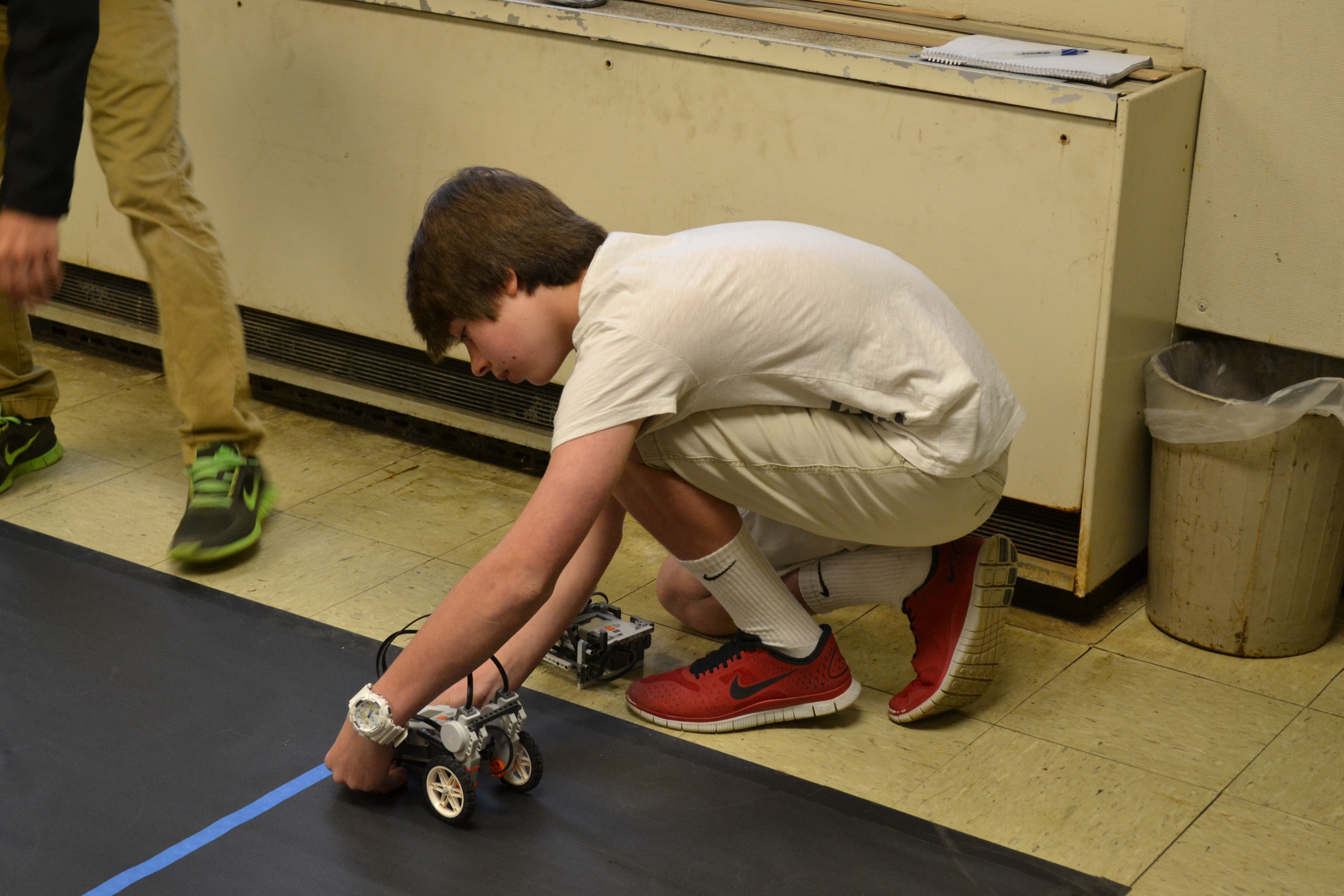 Freshman Andrew Whittington goes through the obstacle course with his robot.