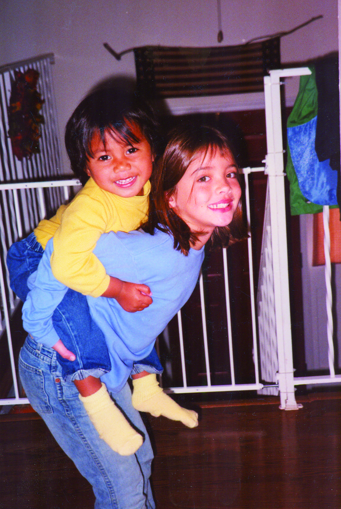 A young senior Greer Blanchette gives her young Samoan sister a piggy-back ride.