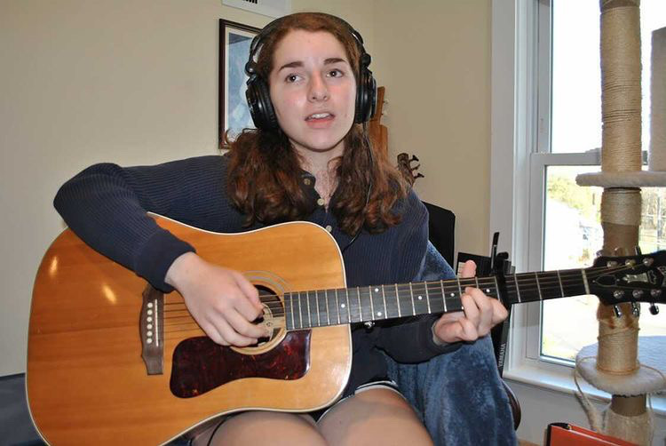 Niamh Kierans practicing with her recording equipment.
