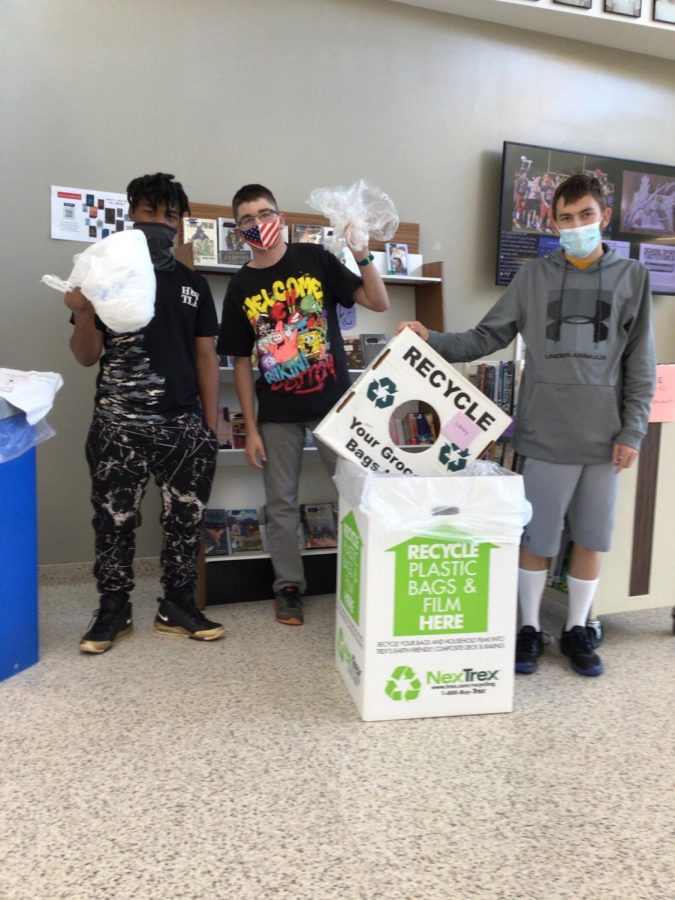 Students from Mr. Funks class bringing the plastic film/bags to collect for the recycling project.