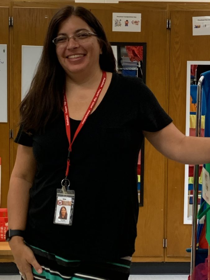 In the Child Development classroom, Nancy Nye poses for a quick photo amid a busy afternoon.