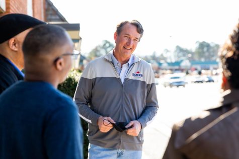 Gov. Youngkin speaks with individuals during his campaign for the November Virginia Gubernatorial Election.