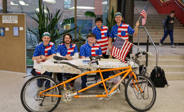 Team+USA+members+pose+with+their+bike.