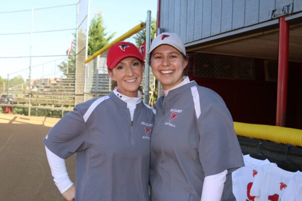 Erika Lamper (left) poses for a photo at the FHS Softball Park.