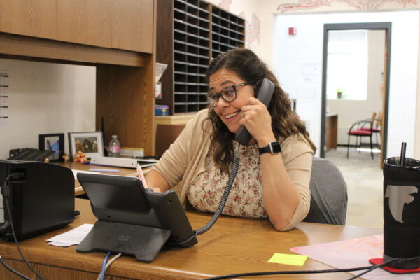 Lowenbach smiles for the camera as a new face in the guidance counseling office.