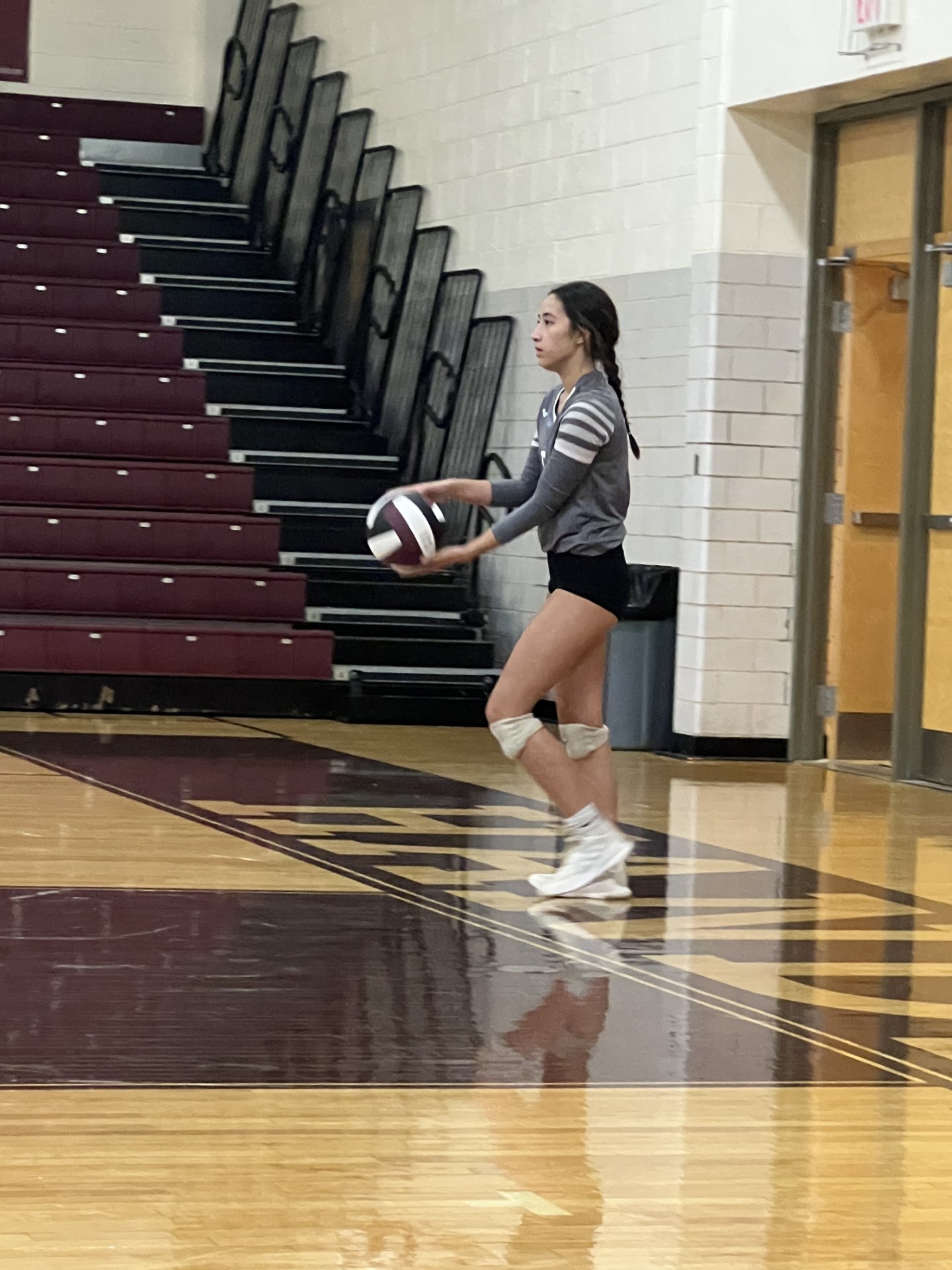 Volleyball player, Marcela Lawhorn getting ready to pitch the ball.