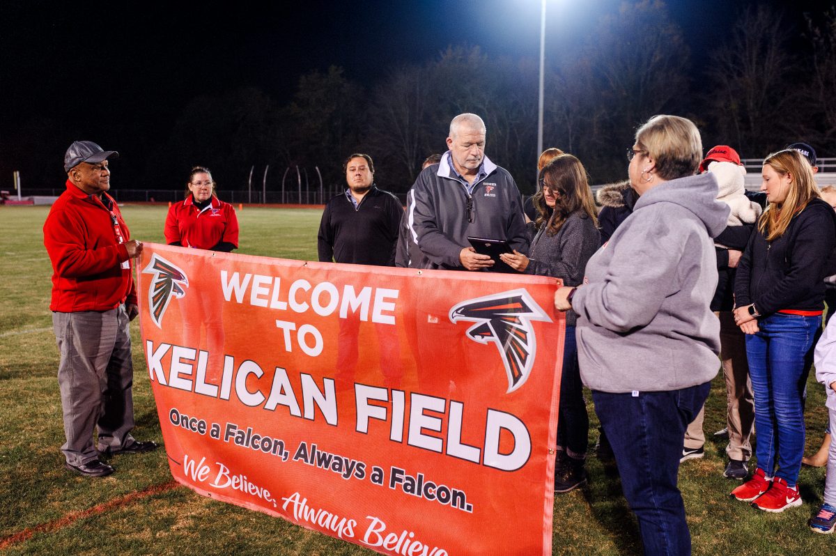 During+the+the+renaming+ceremony+of+Kelican+Field+at+Fauquier+High+School%2C+former+assistant+principal+Jim+Raines+gifts+Susan+Kelican+a+plaque+in+memoriam.