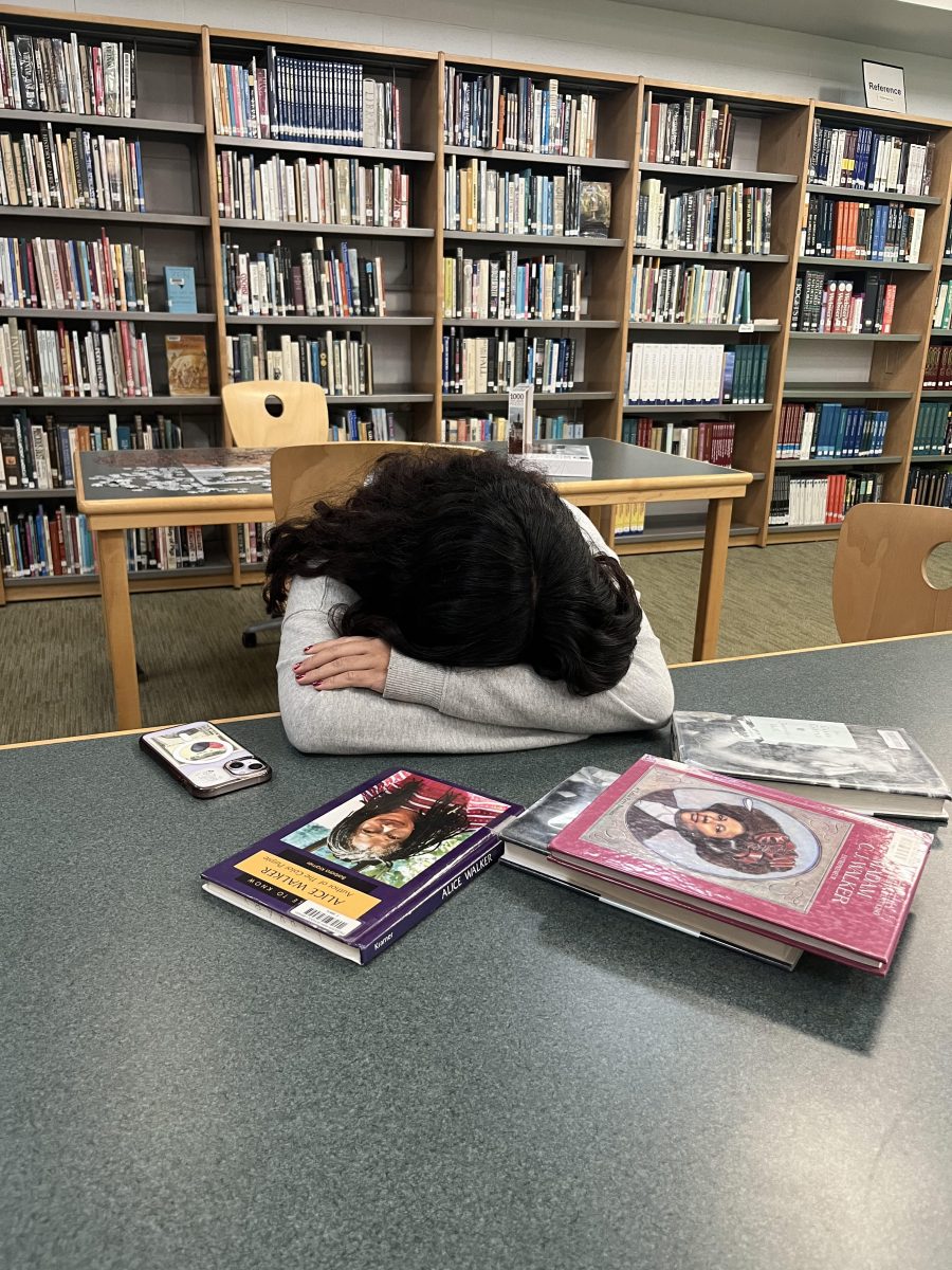 A student in desperate need for a brain break sleeps in the middle of academic enrichment.