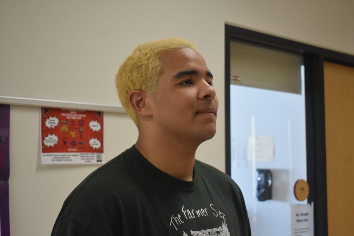 Sophomore+wrestler+Brian+Bland+poses+for+a+picture+with+his+bleached+hair.