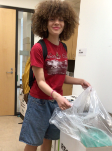 Junior Savina Thornton picks up trash to help with Volunteer Fauquier.