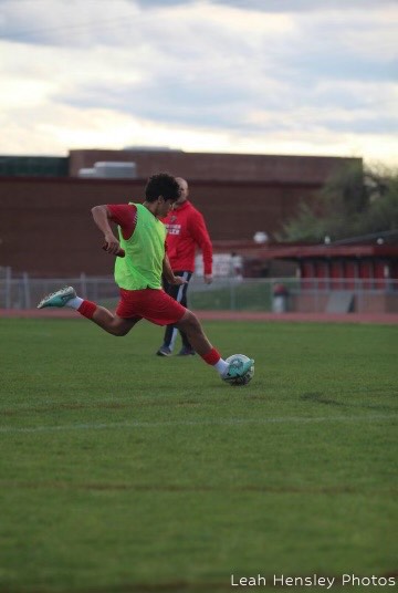 Junior Javier Contreras warms up before a soccer match