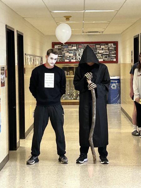 Sophomore Joel Williams portrays the Reaper while senior Wyatt Shaw portrays a ghost to raise awareness of drunk driving.