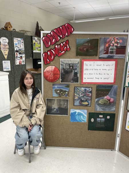 Senior Deanna Rowley shows her amazing art work at the Fauquier County Art Show.