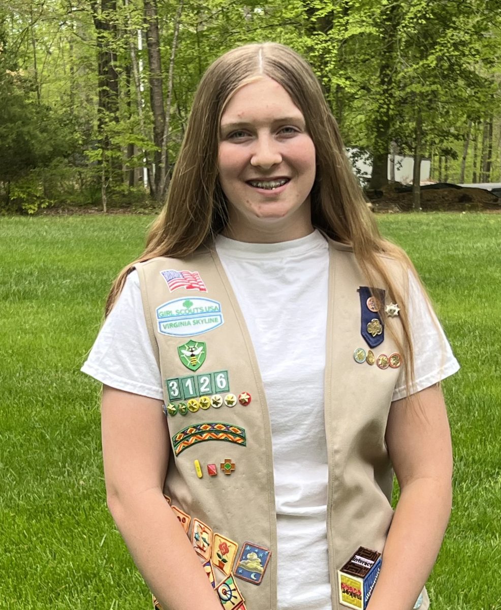 Sophmore Gracie Faulk proudly displays her girl scout badges on her vest.