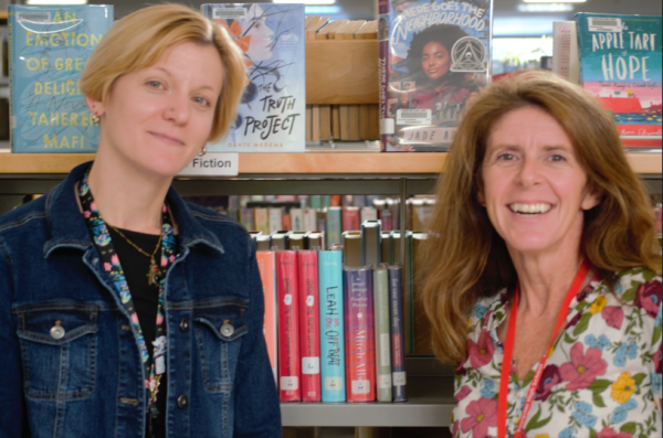 FHS's Librarians, Katelyn Verril and Kathy Davis, in their favorite place surrounded by books. 