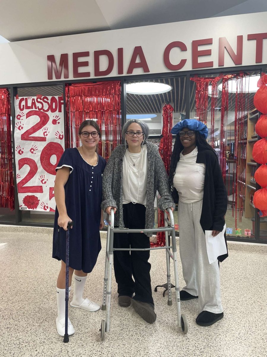 From left to right, seniors Brooke Armistead, Madelynne Martin, Kenza Chienku pose for a photo as senior citizens on Generations Day.