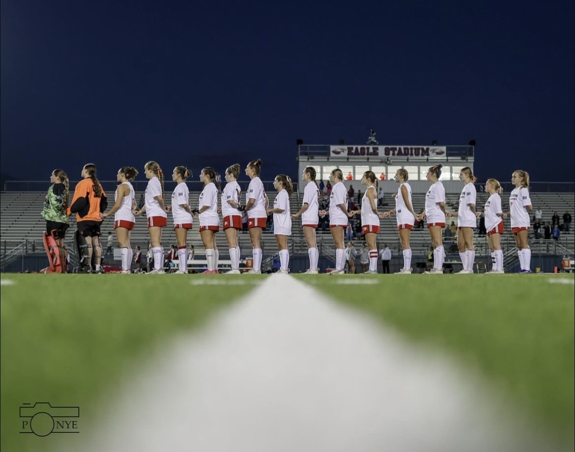 The Fauquier Field Hockey team stands united while the National Anthem is played.