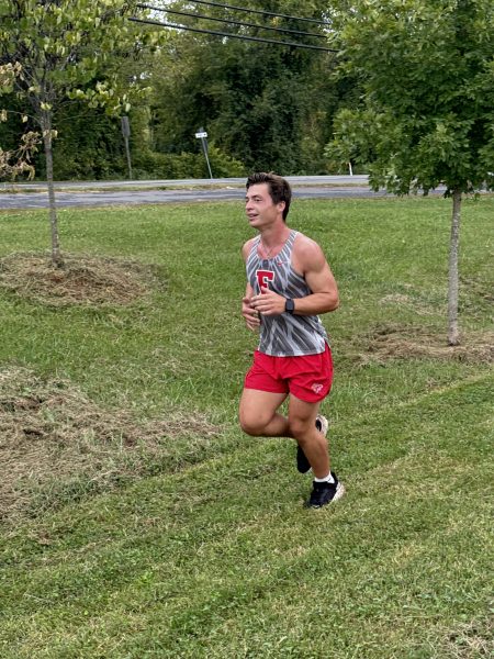 Ryan Sickler running during a cross country meet. 