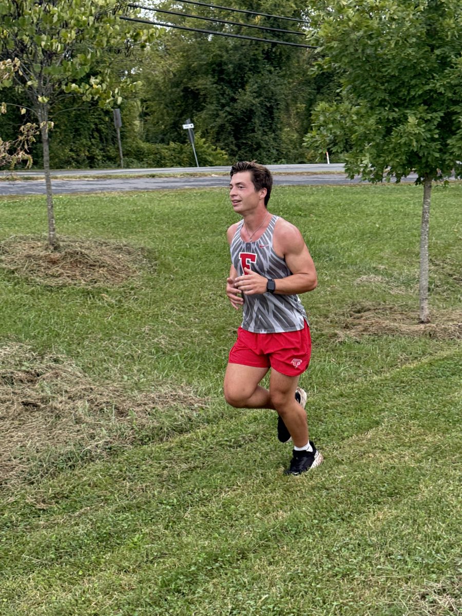 Ryan Sickler running during a cross country meet. 