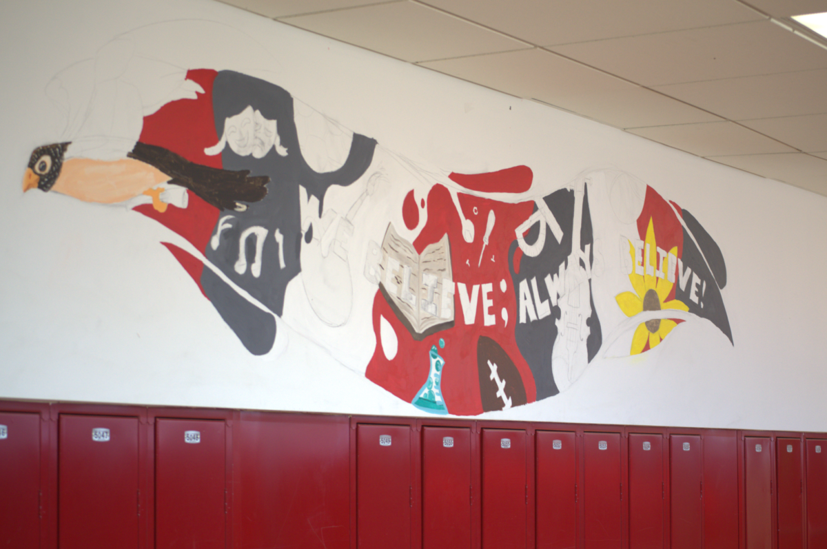 A progression of one of the three murals that are being painted around the school's main building.