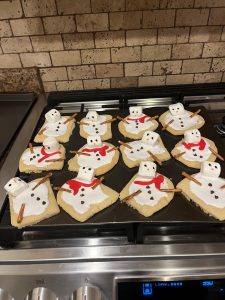 These Melted Snowman Christmas Sugar Cookies freshly decorated and ready to enjoy.