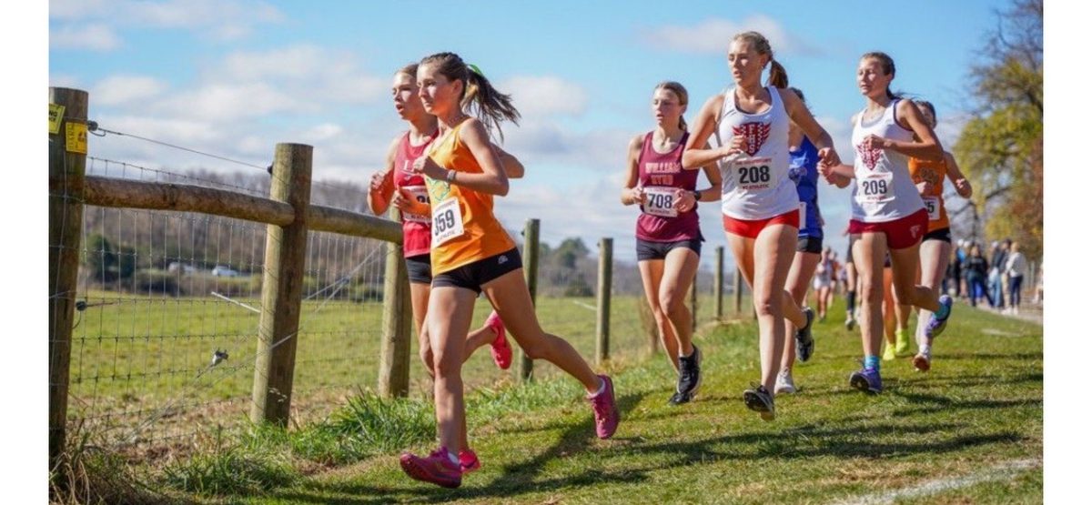 Seneca Scott (center) strives to keep moving forward during a meet.