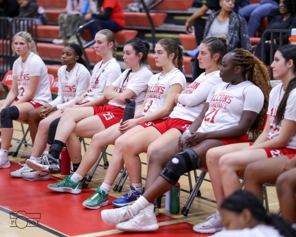 Fauquier girl's basketball team sits together for a game. 