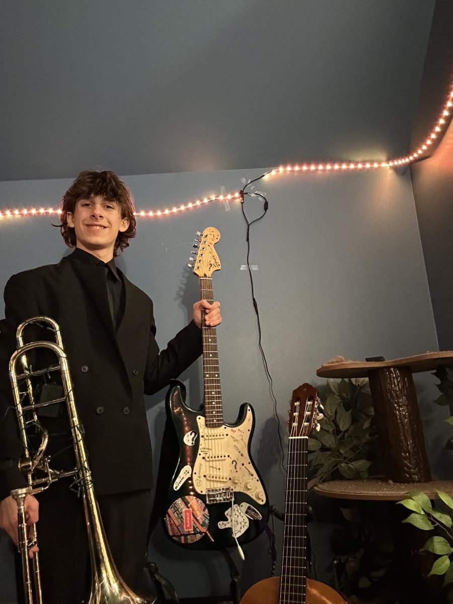 Dylan Rozsel poses with his instruments.