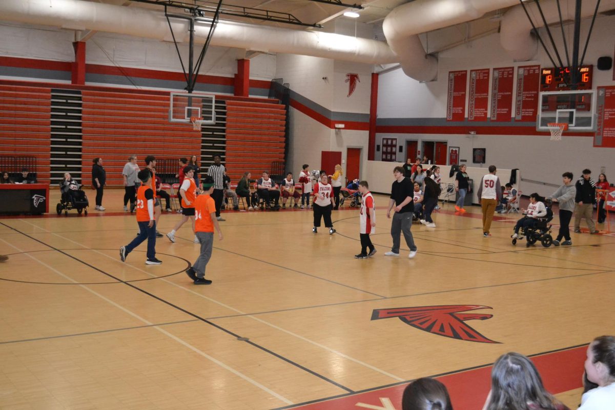 Unified P.E. students playing basketball against Kettle Run