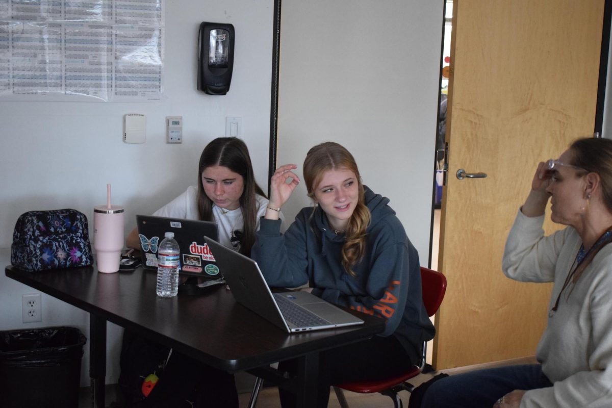 Students in the Yearbook class working to make everything picture-perfect.