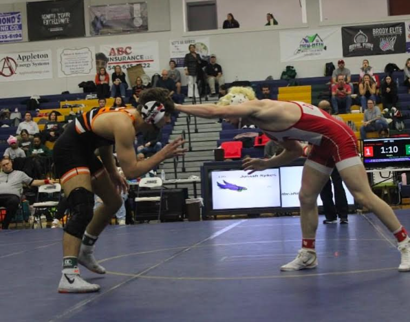 Cole McAndrew in the middle of wrestling the 100th match he's won.