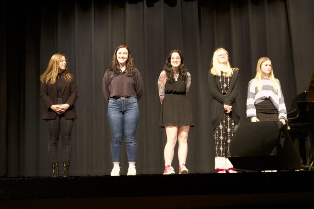 Voice of Fauquier contestants of 2022 stand proudly on stage. 