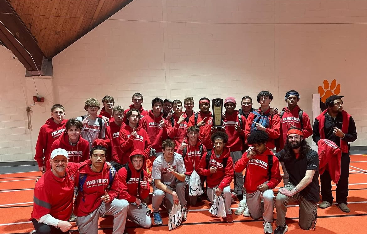 The Boys Indoor Track Team posing after winning Regionals.