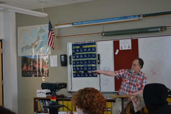 Ronald Pfeiffer teaching a group of eager students.