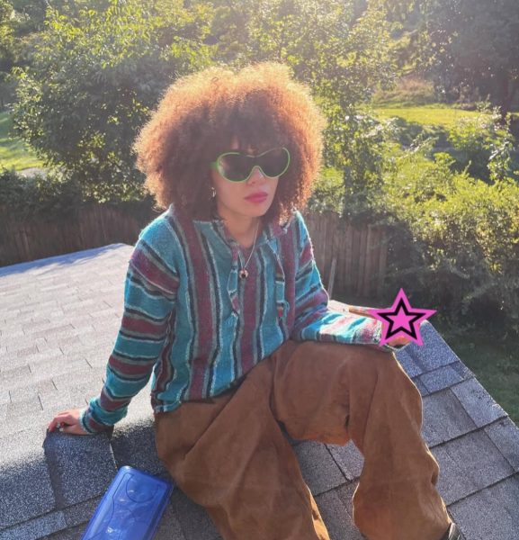 Savina Thompson rocks a stylish baggy outfit with fun accessories.
