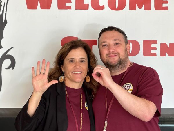 Principal Angela Castaldy posing with Assistant Principal Phillip Nobblitt  celebrating the 50th anniversary of Marshall Middle School.