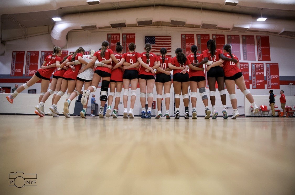 FHS volleyball team celebrates their accomplishments after a game. 