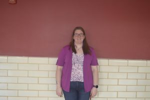 Dr. Sara Ansteatt stands proudly showing her excitment to join the science department at FHS.