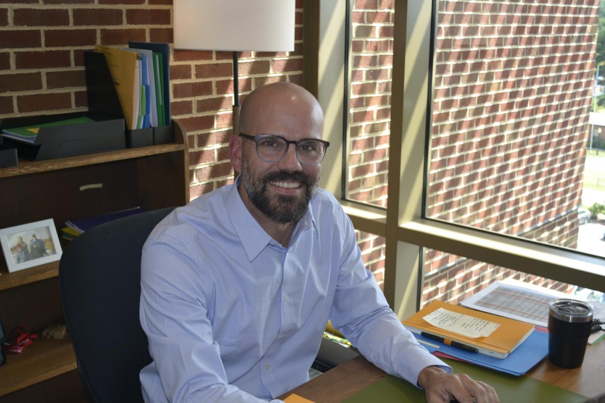 Assistant Princial Brousse settles into his new role at his desk, ready to lead with purpose.