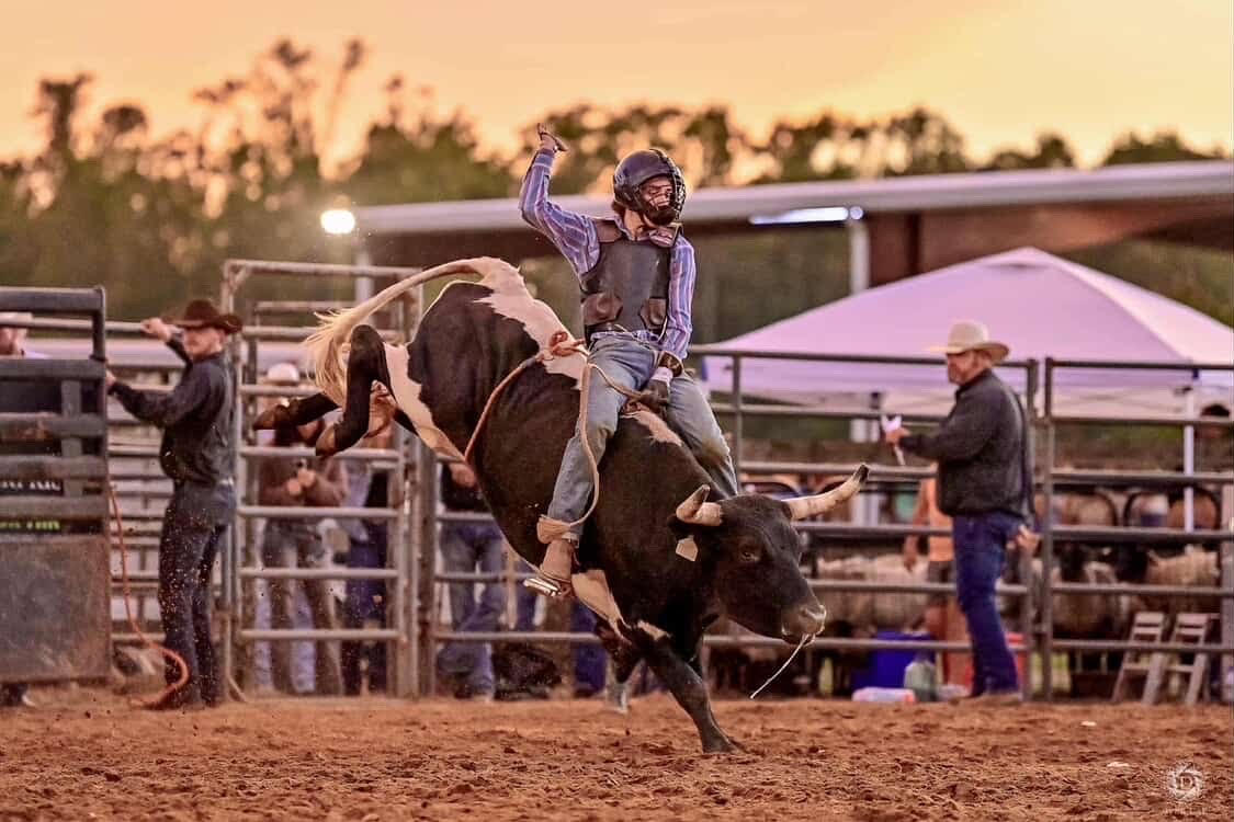 Student bull rider, Samuel Cooper, shows grit and balance while taking on the bull.