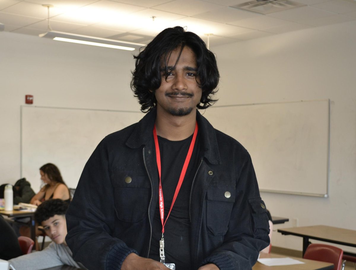 Fahad Mohammed smiles as he gets ready to teach his math class.