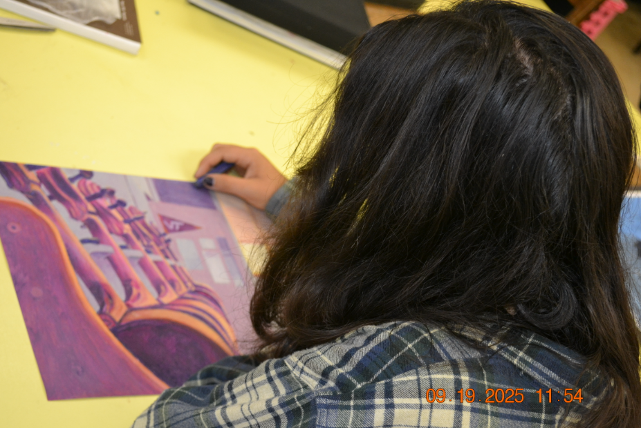 Senior Ellen Crane completes an oil pastel masterpiece.