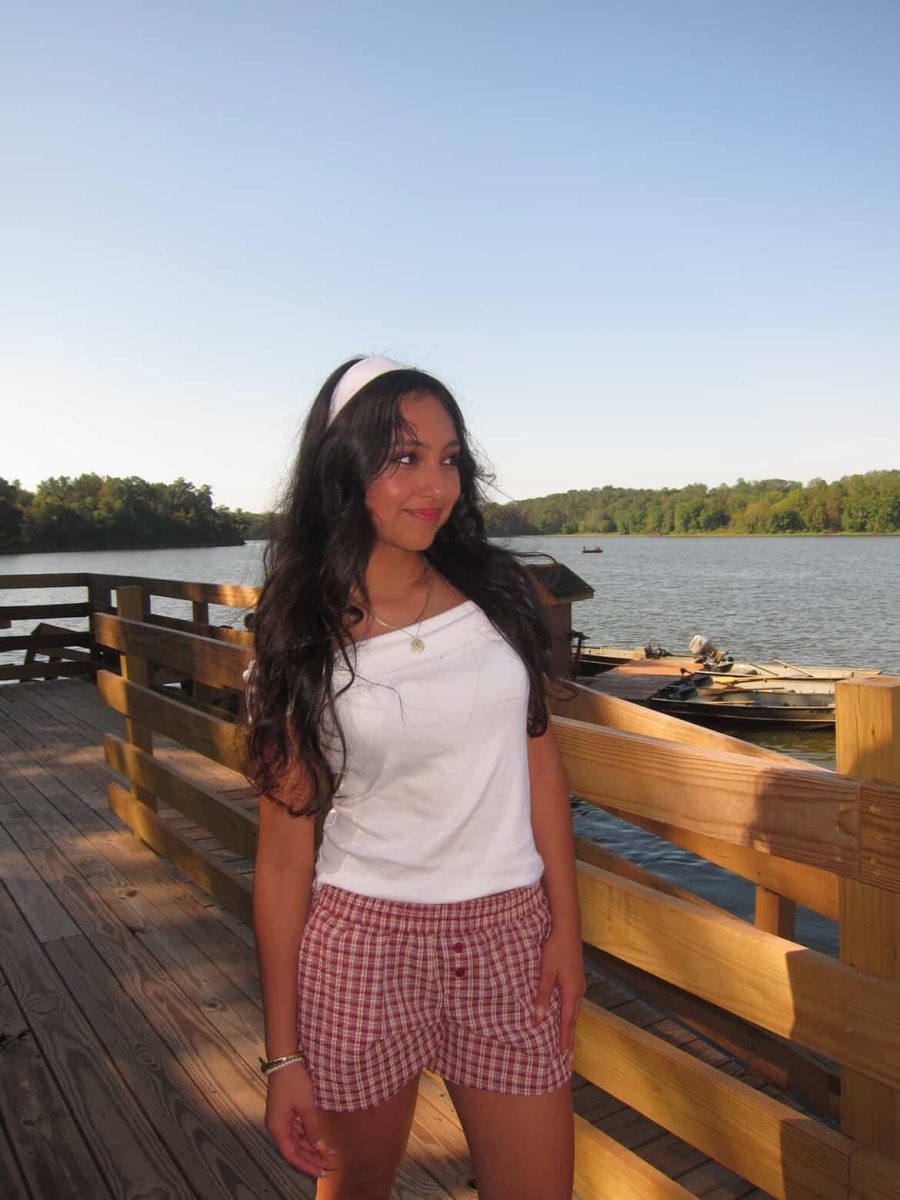Cynthia shows off her trendy white headband and plaid shorts combo at the Class of 2026's Senior Picnic.