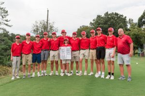 The FHS golf team stands proud while showing off their winning score sheet. 