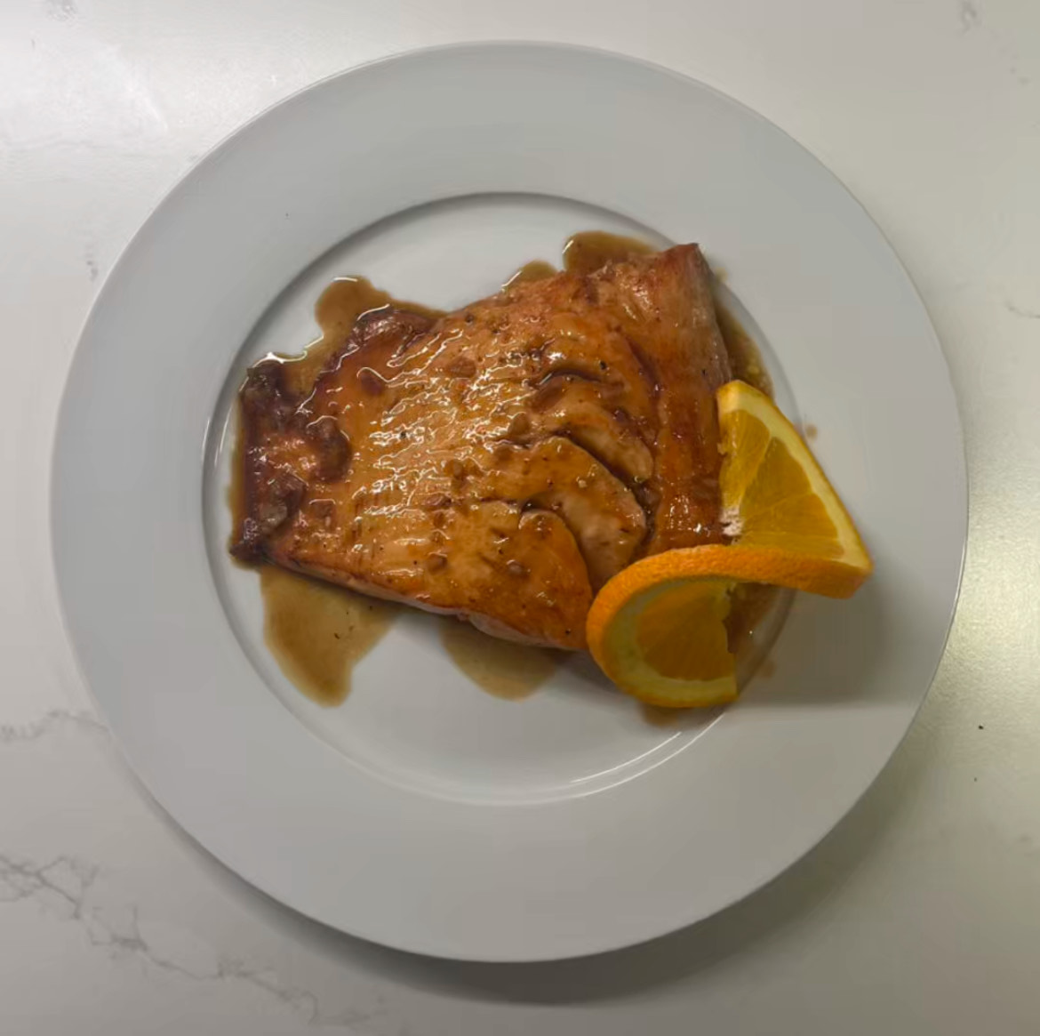 A perfectly balanced, syrupy glaze made from fresh orange juice, honey, and soy sauce gives this pan-seared salmon a flavorful finish