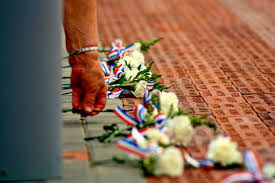 Veterans are honored with a simple tribute, white flowers, laid with respect and gratitude.