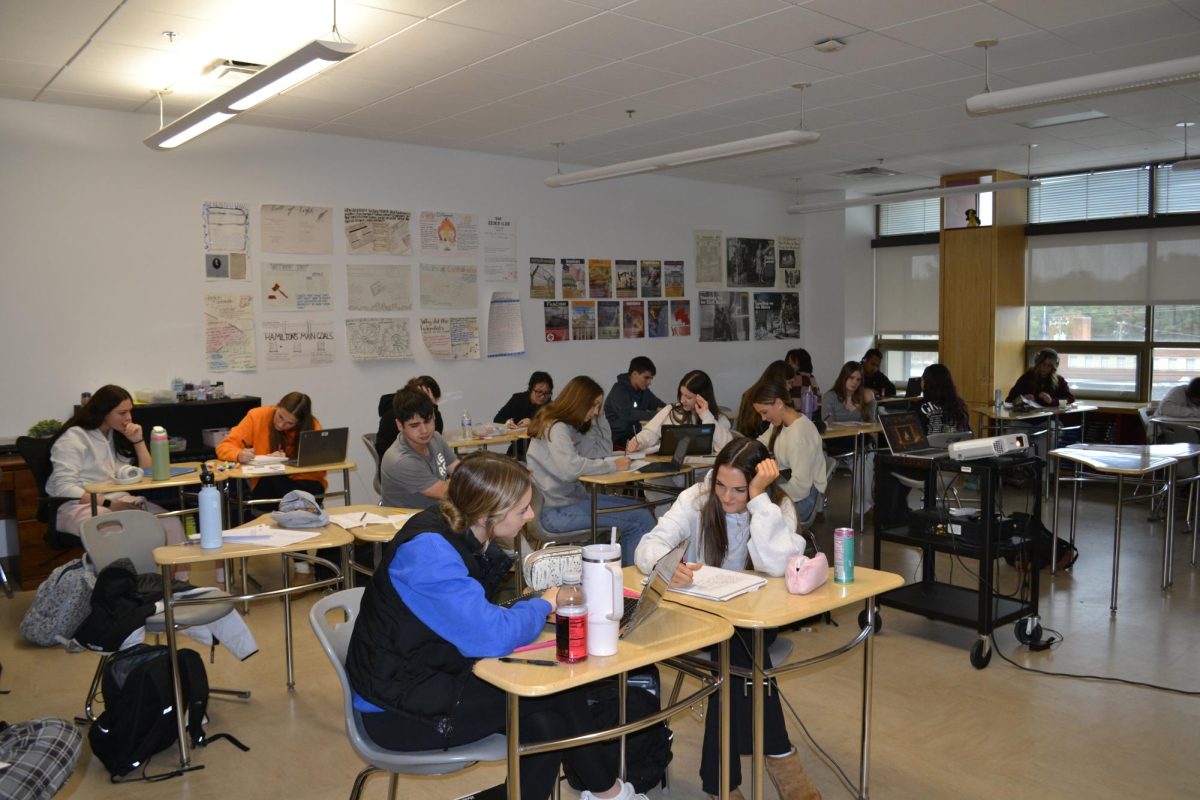 Anslie Bogart's psychology students diligently working on their assignments.