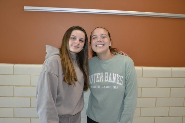 Senior Khloe Poole and freshman Avery Sorrentino share a warm embrace as Poole passes on all that she has learned.